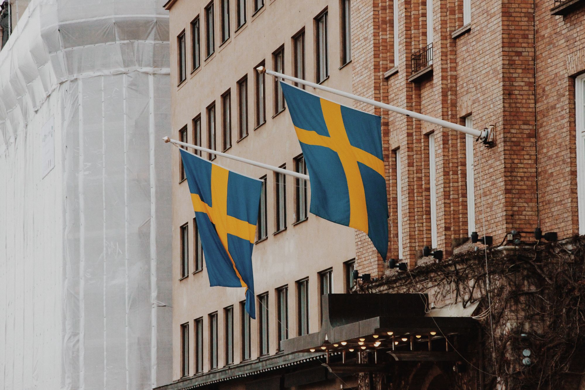 Picture of Swedish flags hanging on a building in Gamla stan, Stockholm