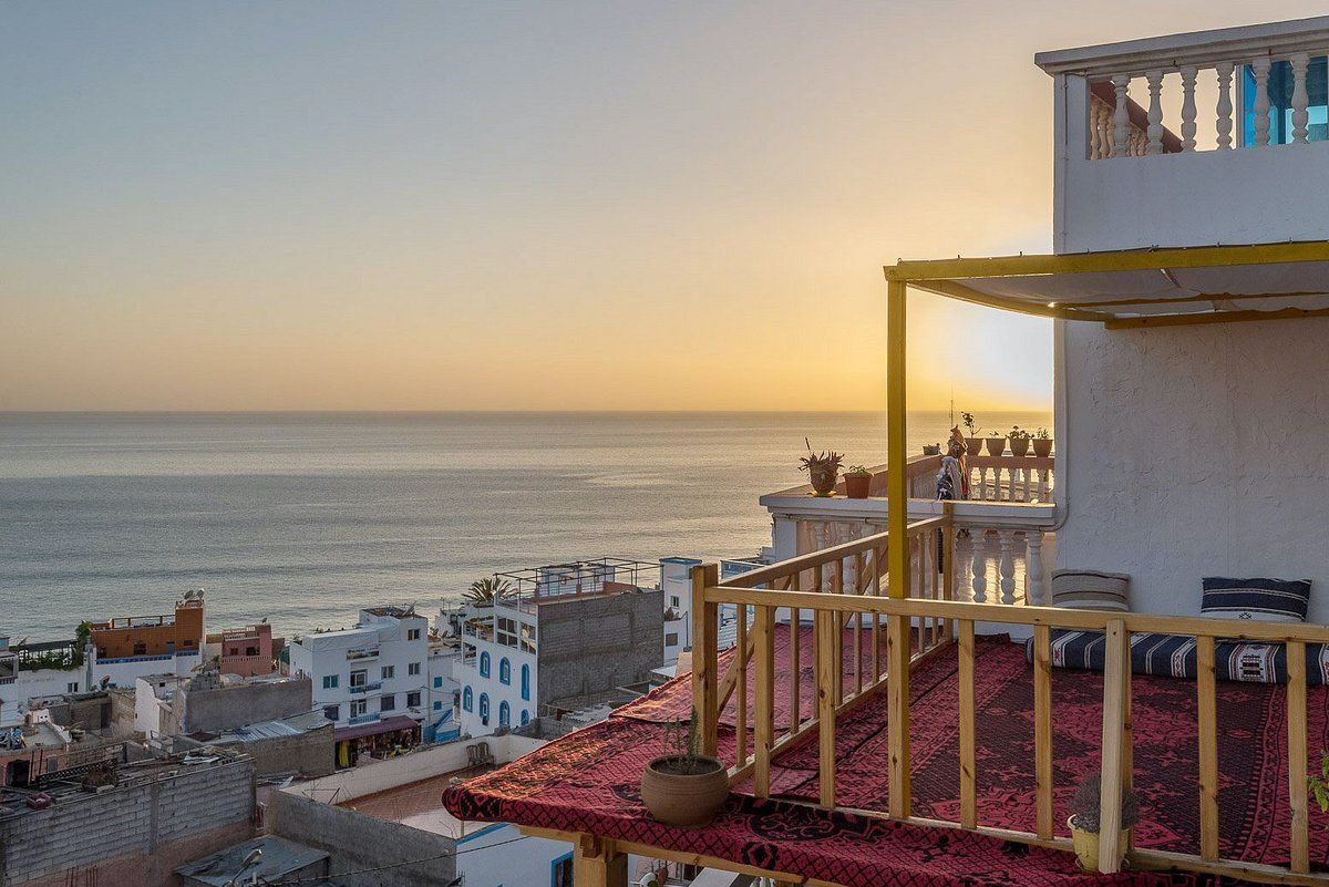 Photo of a terrace deck overlooking the Mediterranean Sea at SunDesk, a coliving space located on the coast of Morocco