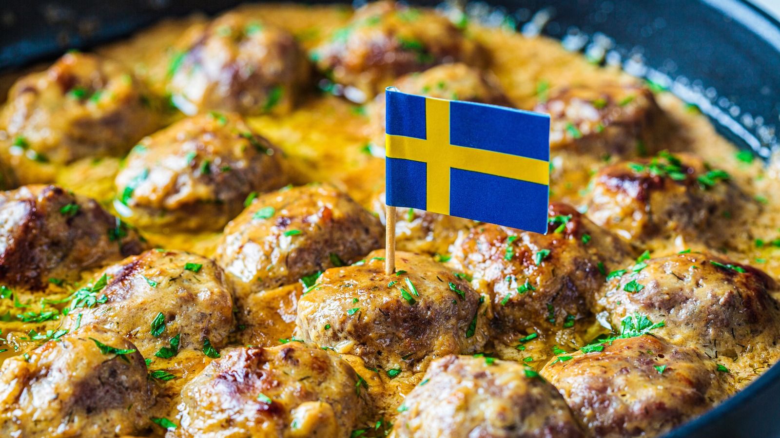 Photo of Swedish meatballs with a small Swedish flag placed on top