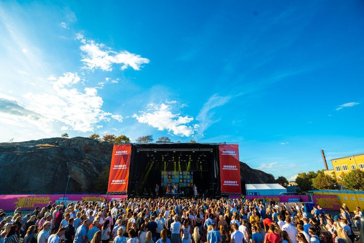 Photo of a crowd gathered in front of a stage at an EDM concert in Stockholm