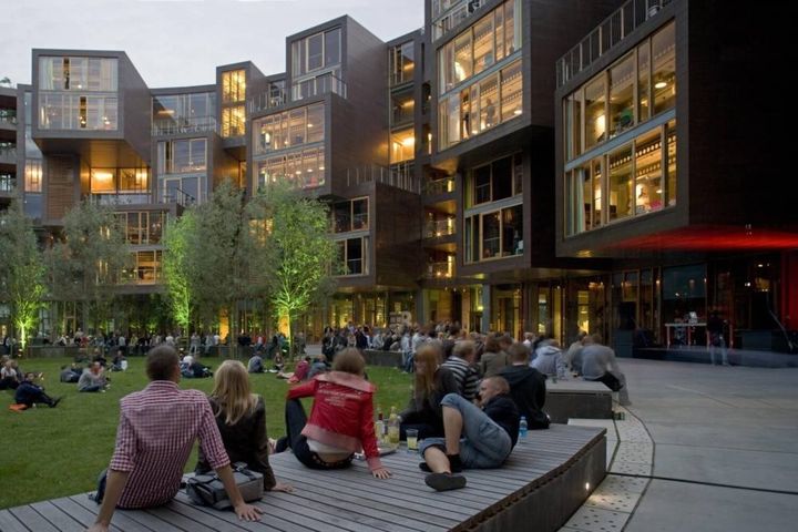 Groups of students sitting in a common area located within one of the more famous student housing locations in Copenhagen