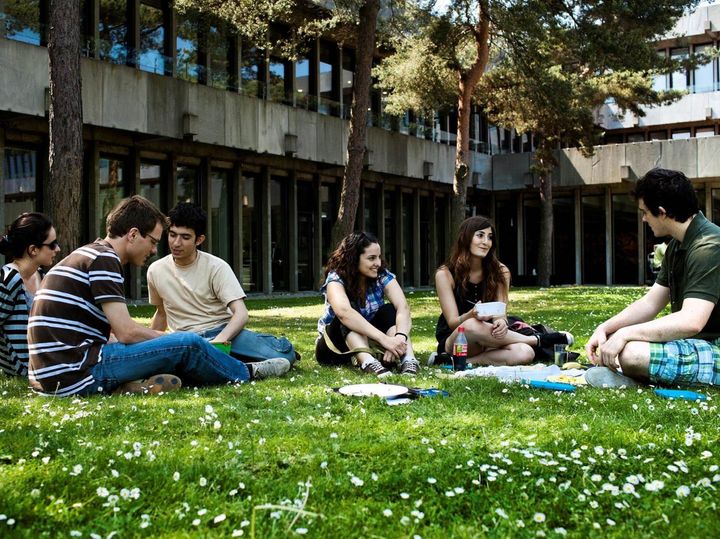 Photo depicting a group of students sitting 