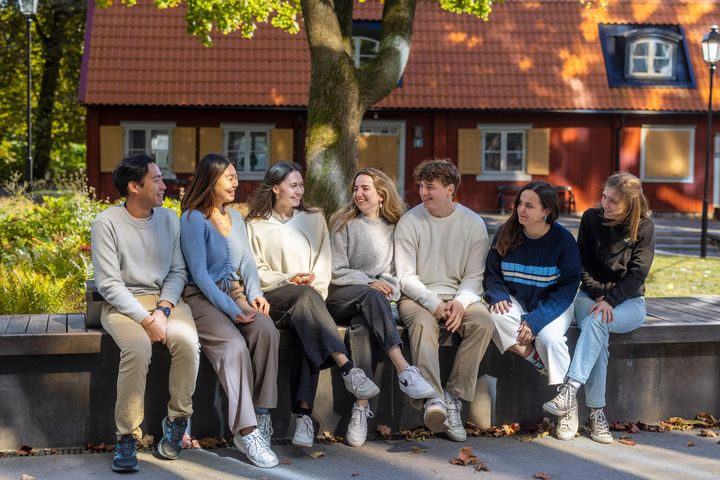 A group of students seated together on campus at Karolinska Institutet in Stockholm, Sweden