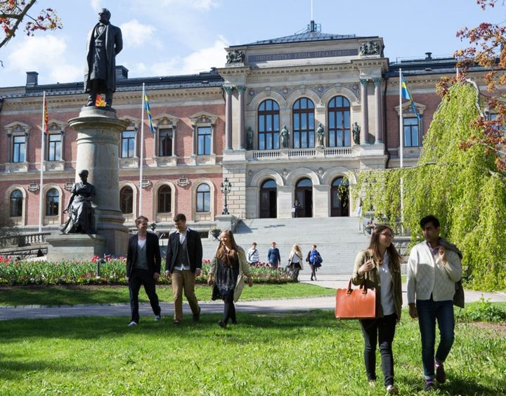 Students walking across campus at Uppsala University in Uppsala, Sweden