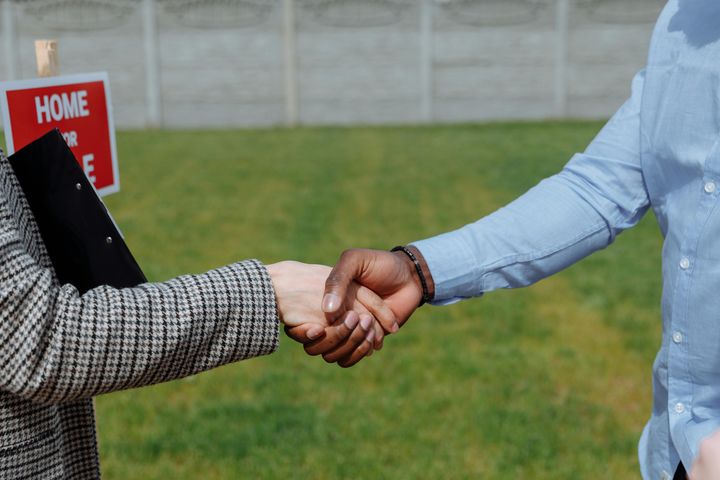 A handshake after buying a house