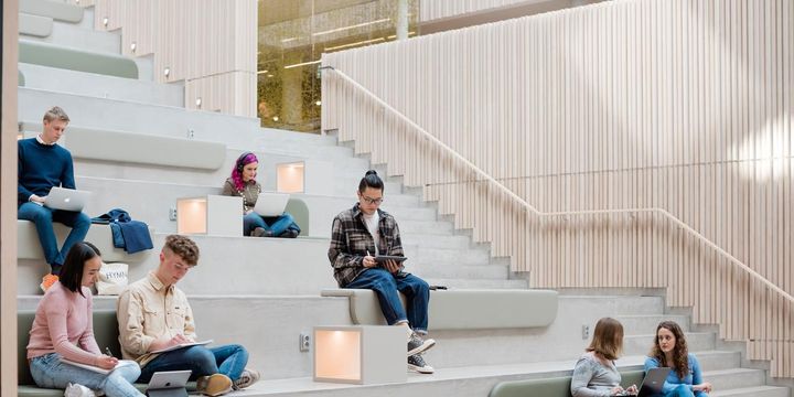 Students sitting on the steps at the University of Gothenburg in Sweden