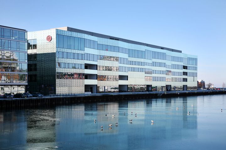 Malmö University campus building, overlooking a body of water